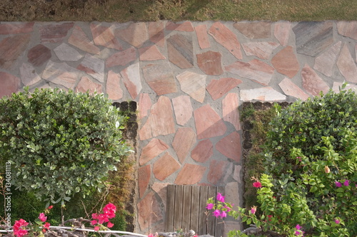 Flagstone walkway intersection with landscaping
