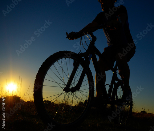 Fototapeta Naklejka Na Ścianę i Meble -  Male cyclist driving outdoors