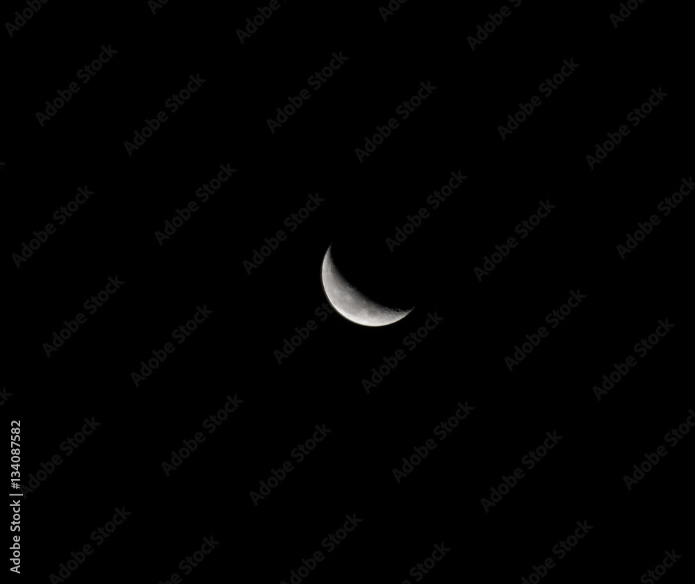 Moon over dark black sky at night Moon over dark black sky at night