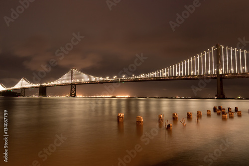San Francisco-Oakland Bay Bridge At Night From The Embarcadero