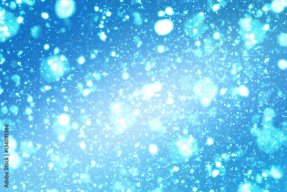 Abstract round silver bokeh or glitter lights on blue background. Circles defocused particles