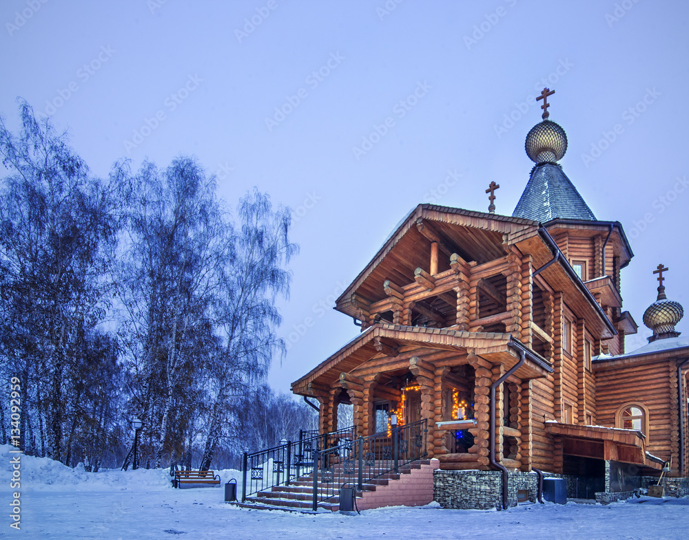 Winter landscape with old rural wooden chapel