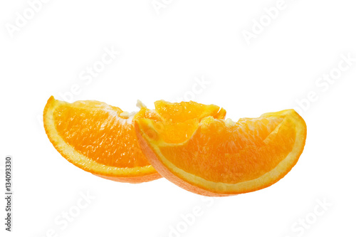 Ripe slice of orange on a white background