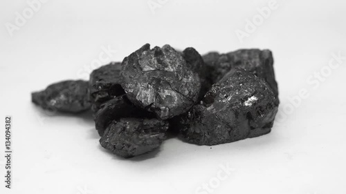 A sample  from an industrial graphite mine of graphite ore that is eventually processed and used in batteries, carbon steel, lubrication, electrodes and other industrial uses.