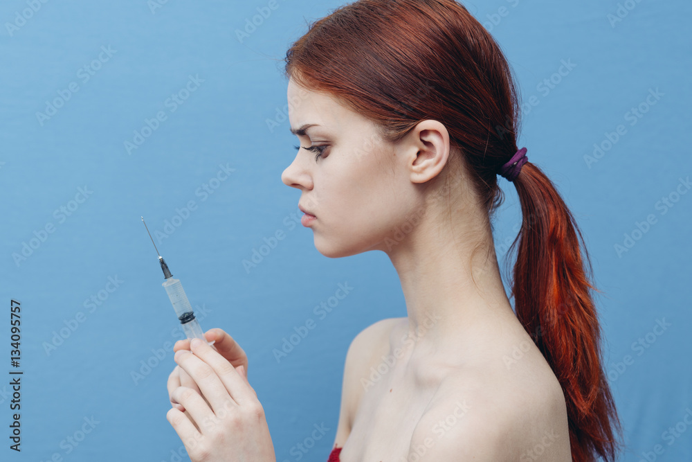 woman with a syringe, injection, beauty, botox woman with a syringe, injection, beauty, botox