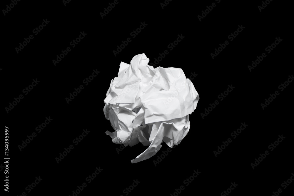 Crumpled paper ball isolated on black with clipping path