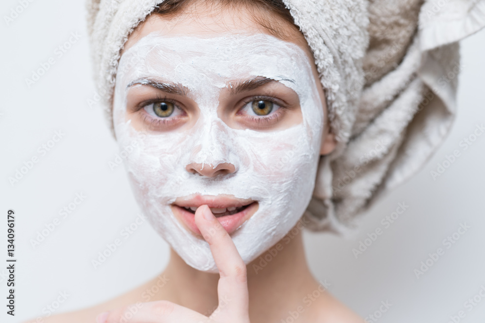woman with a rejuvenating mask on her face