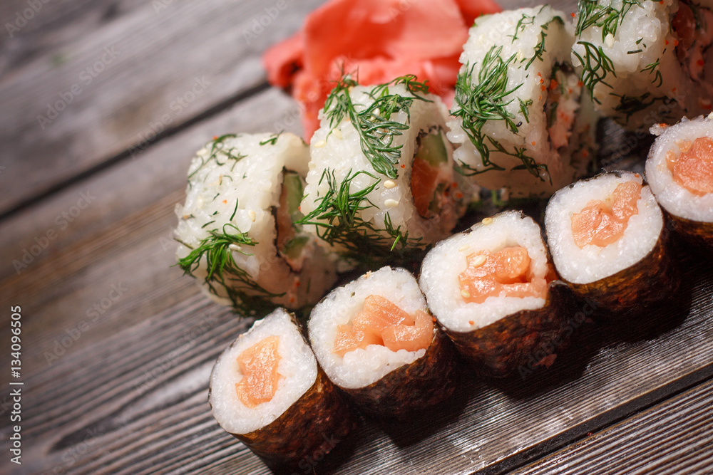 sushi with seafood and ginger on a wooden background sushi with seafood and ginger on a wooden background