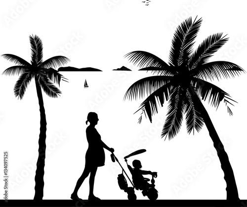 Pregnant woman walking with her son in tricycle on the beach, one in the series of similar images silhouette