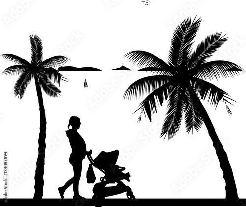 Pregnant woman walking with her son on stroller on the beach, one in the series of similar images silhouette