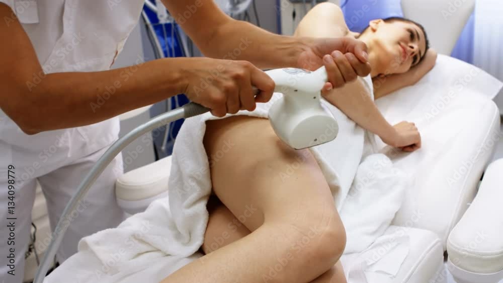 Woman getting anticellulite and anti fat therapy