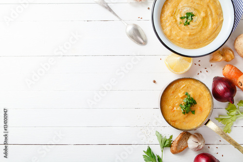 Wallpaper Mural Roasted pumpkin and carrot soup on white wooden background. Copy space. Vegetarian concept Torontodigital.ca