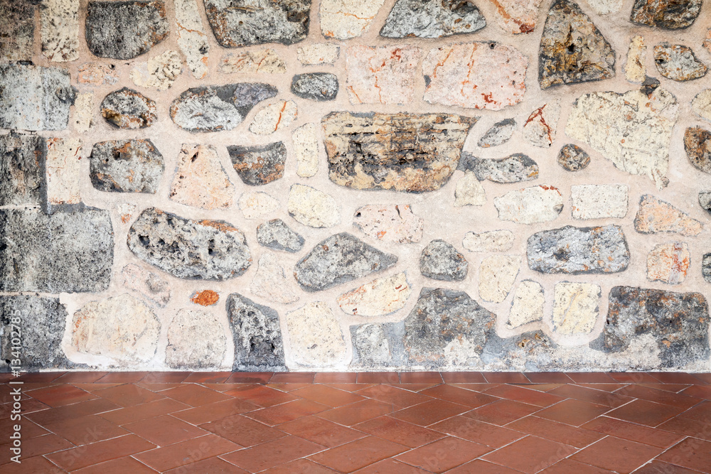 Fototapeta premium Gray stone wall and red floor tiling