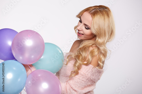 Young beautiful blonde girl holding balloons © ZoomTeam