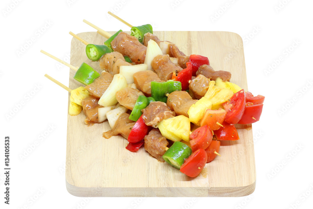 pork and chicken meat pieces with vegetables on white pork and chicken meat pieces with vegetables on white