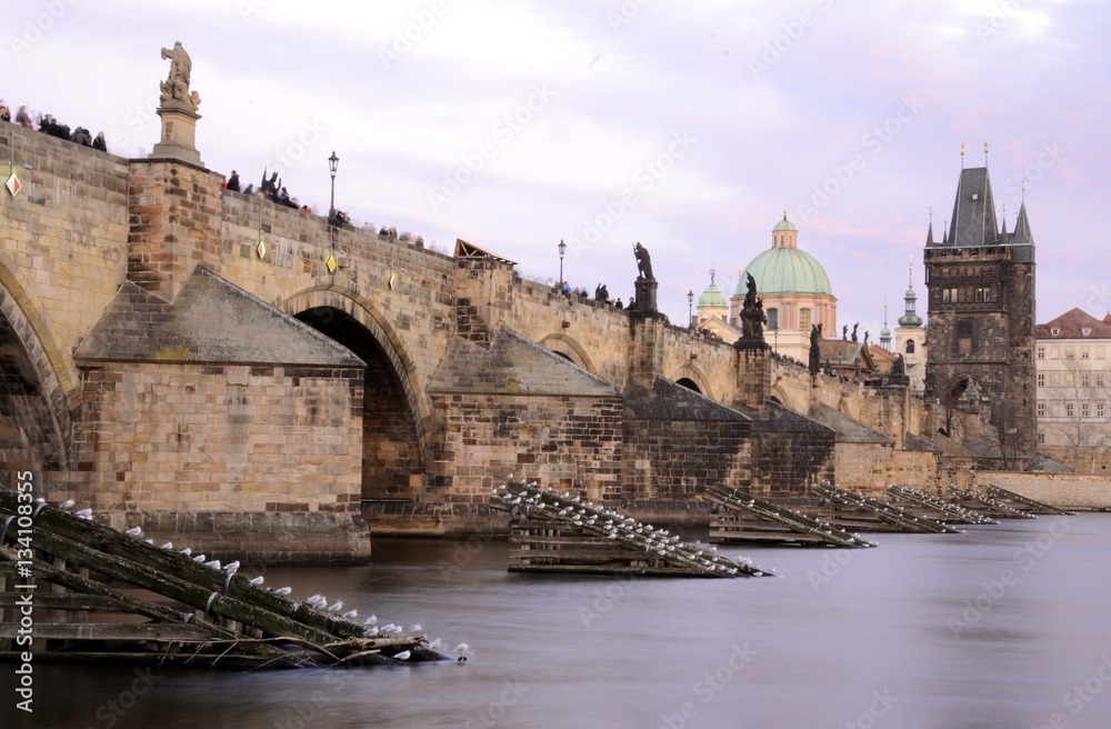 Architecture from Charles bridge in Prague with cloudy sky