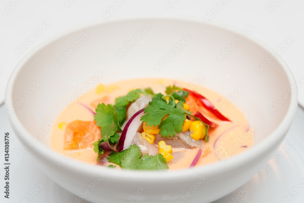 Sea bass ceviche with pumpkin, cilantro, corn and onion