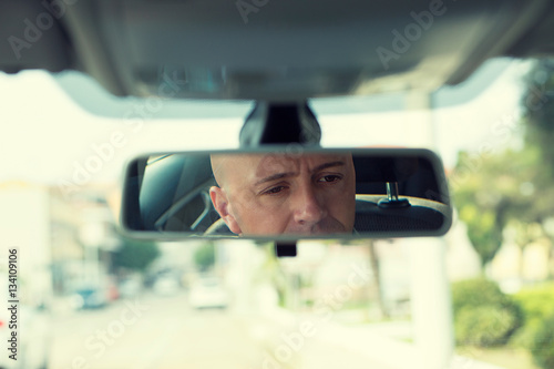 Wallpaper Mural rear mirror view reflection of handsome elegant serious business man Torontodigital.ca