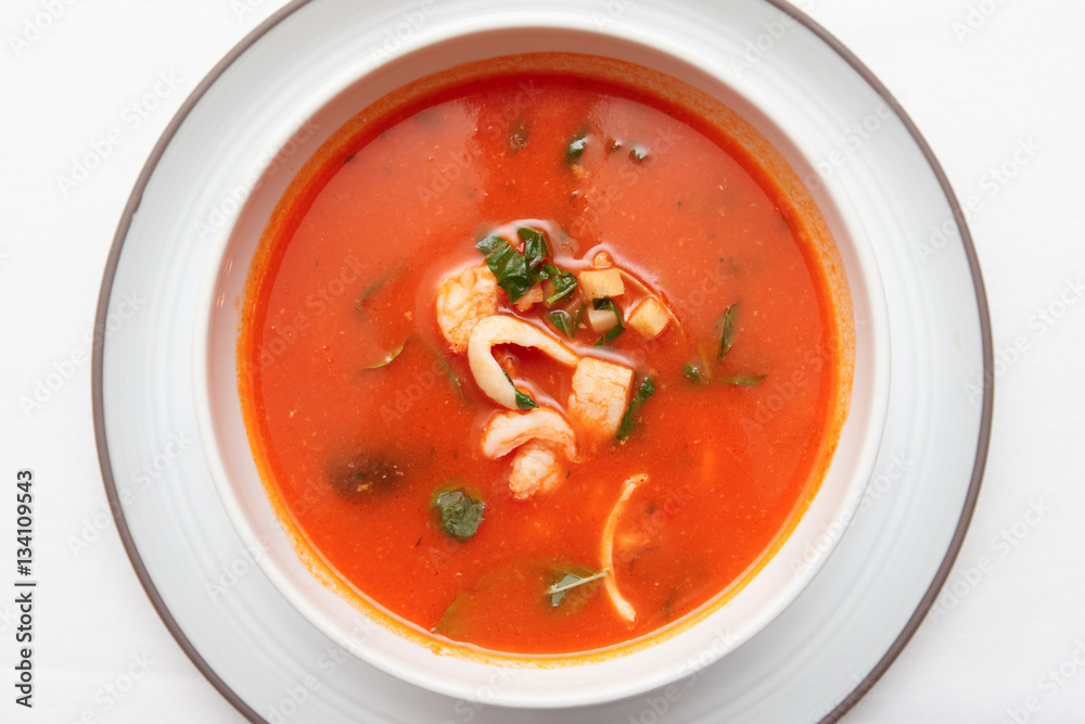Tomato soup with fish and shellfish shot from above Tomato soup with fish and shellfish shot from above