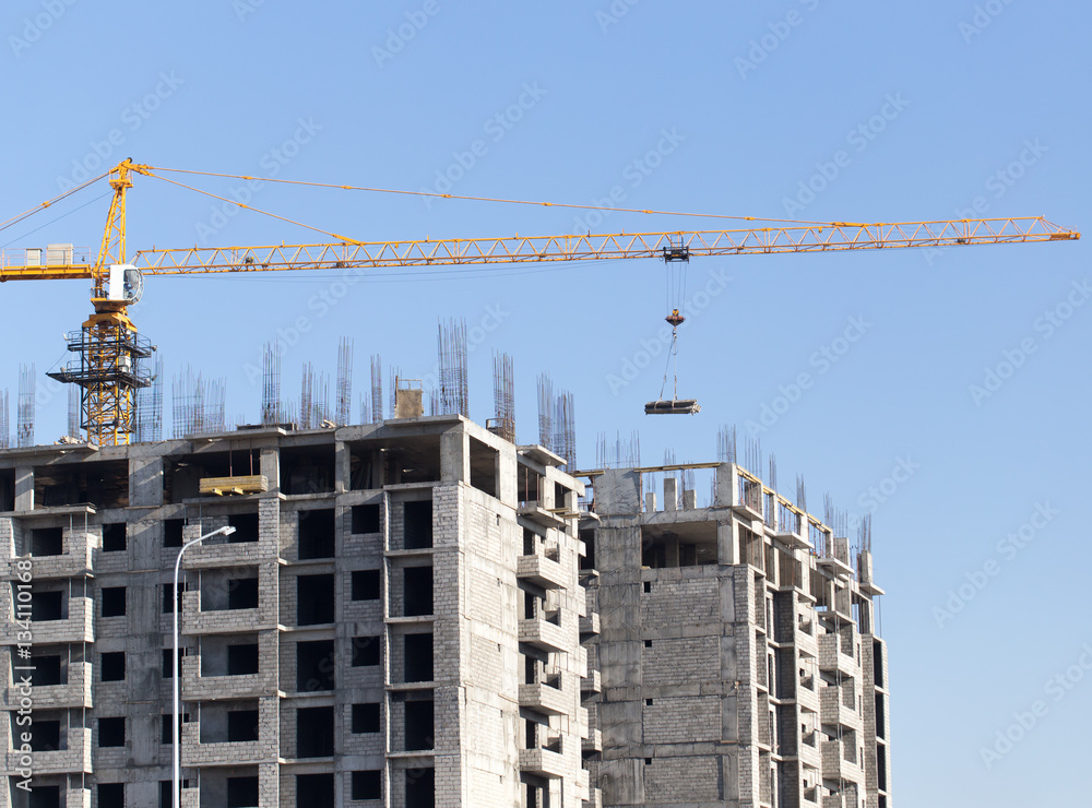 Crane building a multi-storey building Crane building a multi-storey building