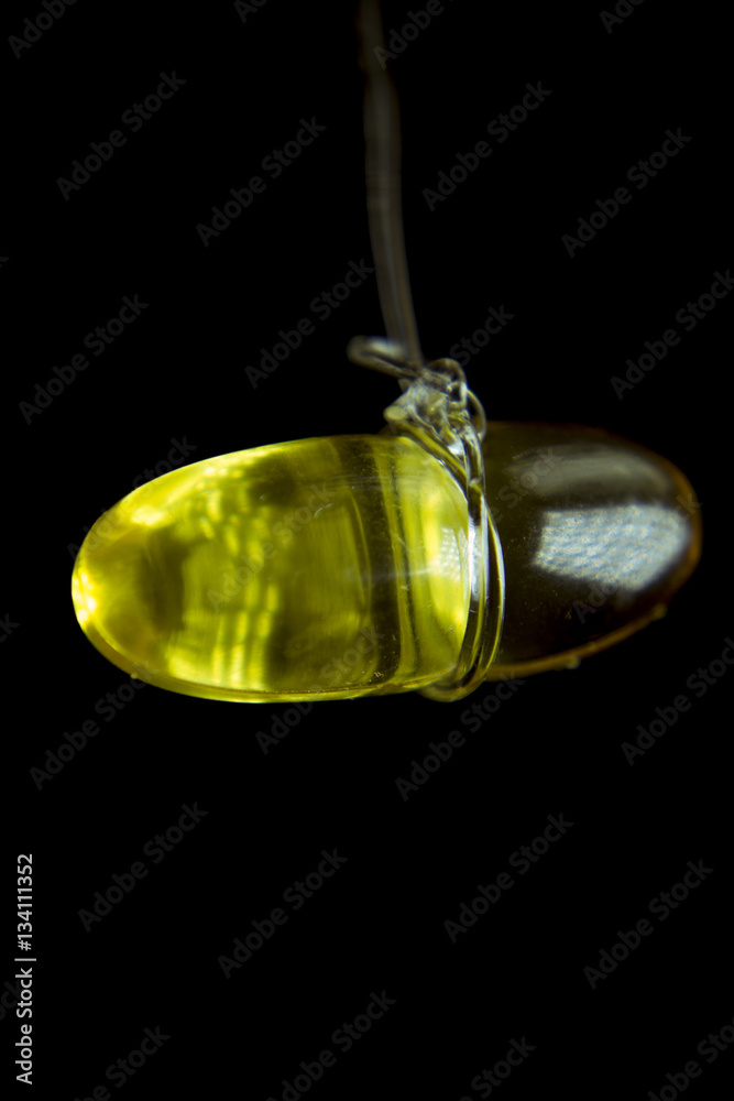 Capsule of fish oil suspended in the air