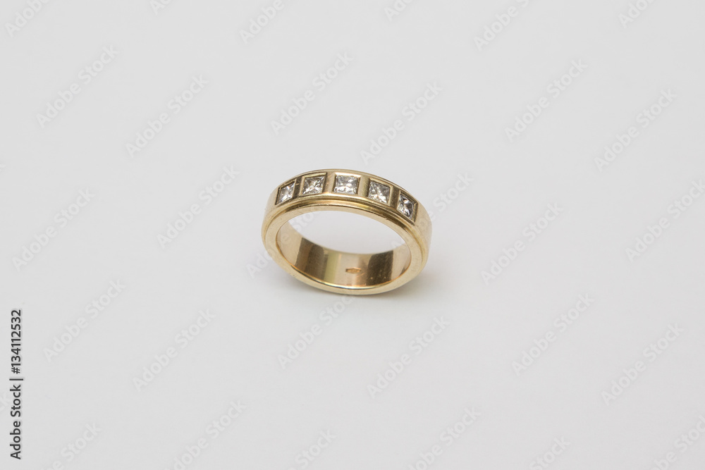 Yellow gold wedding ring with diamonds isolated on white Yellow gold wedding ring with diamonds isolated on white