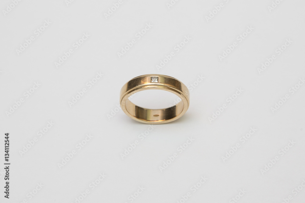 Yellow gold wedding ring with diamonds isolated on white Yellow gold wedding ring with diamonds isolated on white