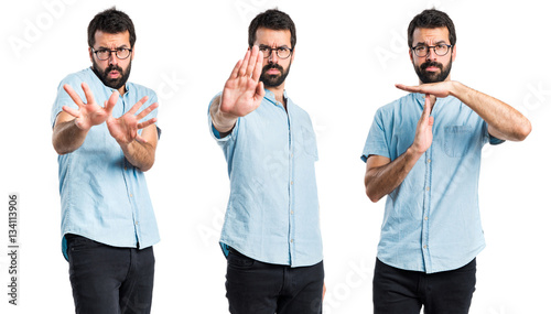 Handsome man making stop sign