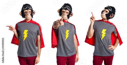 Superhero monkey man pointing up