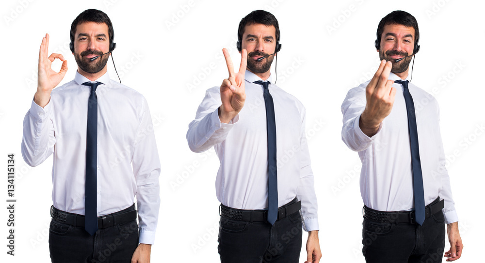 Young man with a headset counting two Young man with a headset counting two
