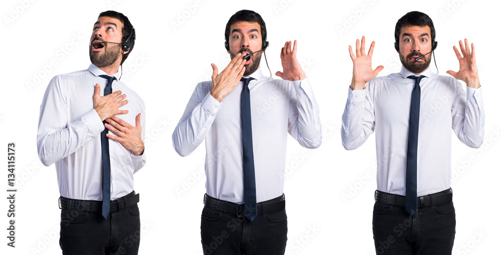 Handsome telemarketer man doing surprise gesture Handsome telemarketer man doing surprise gesture