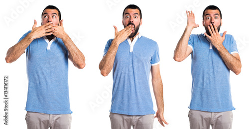 Man with blue shirt doing surprise gesture