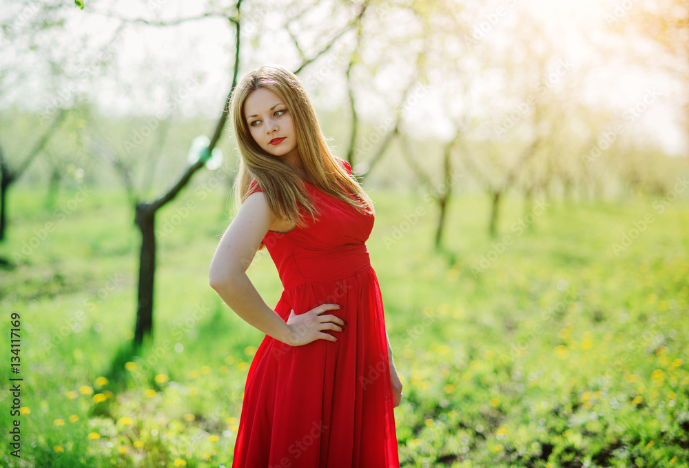 Portrait of light hair girl on red dress background spring garde Portrait of light hair girl on red dress background spring garde