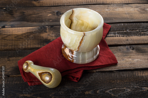 onyx Mortar and Pestle on wooden Background photo