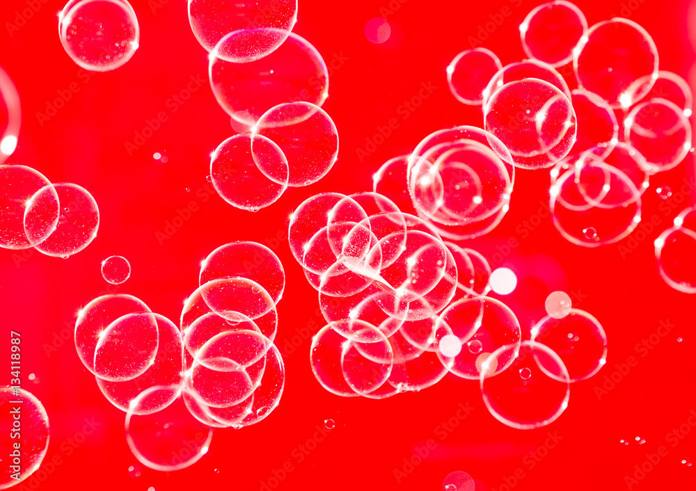 Soap bubbles red abstract background
