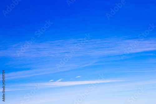 blue sky background with tiny