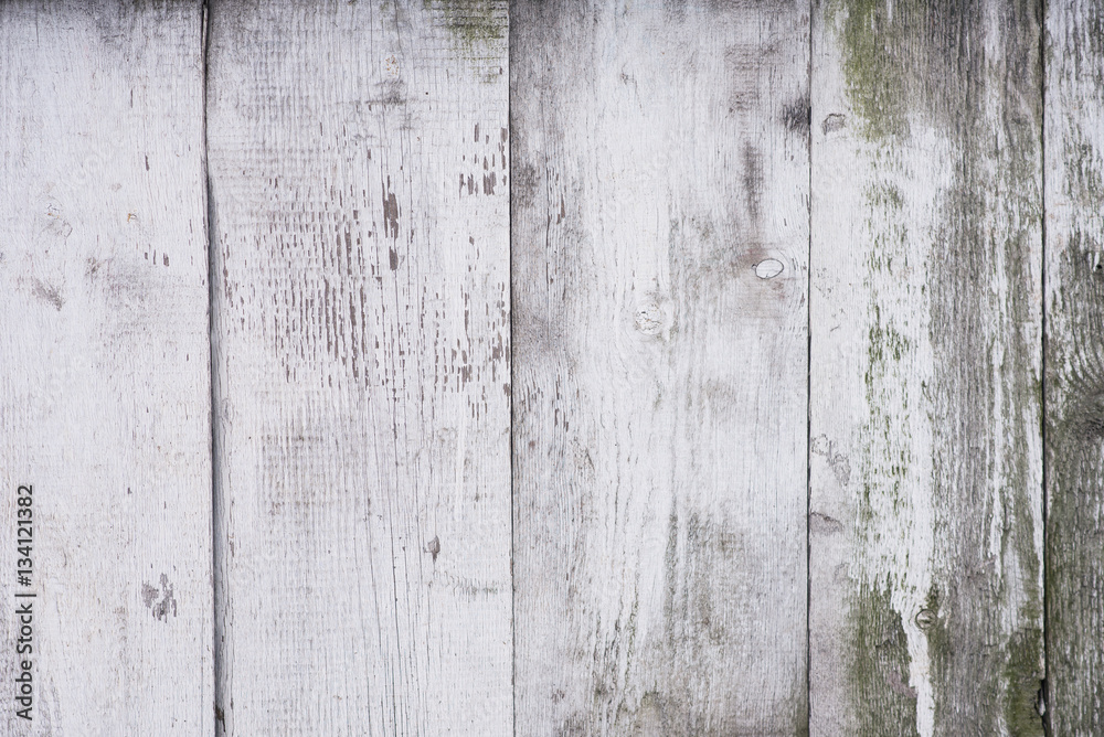 Texture of old shabby wooden planks fence with peeling paint, vintage wooden table surface, aged wooden background