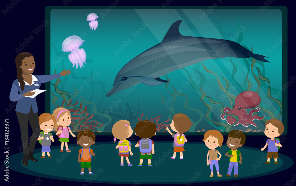 Obraz premium Children on an excursion to the aquarium