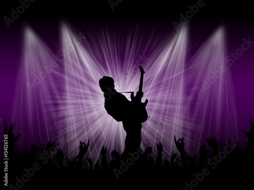 Guitarist on the stage with background lights