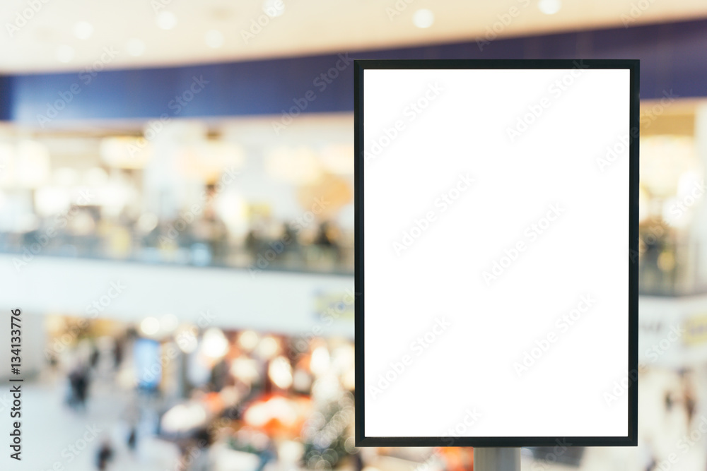 Blank mock up of vertical poster billboard sign with copy space for your text message or content in modern shopping mall.