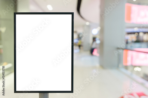 Blank mock up of vertical poster billboard sign with copy space for your text message or content in modern shopping mall.