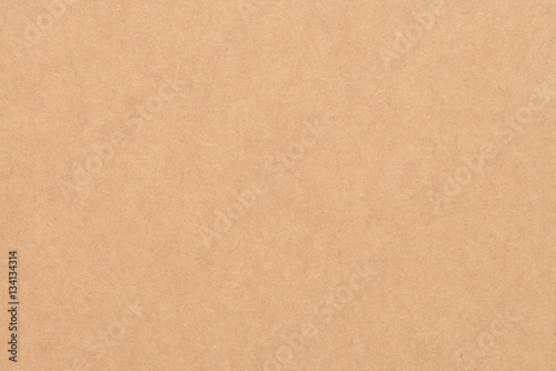 Paper texture - brown kraft sheet background. © tirachard