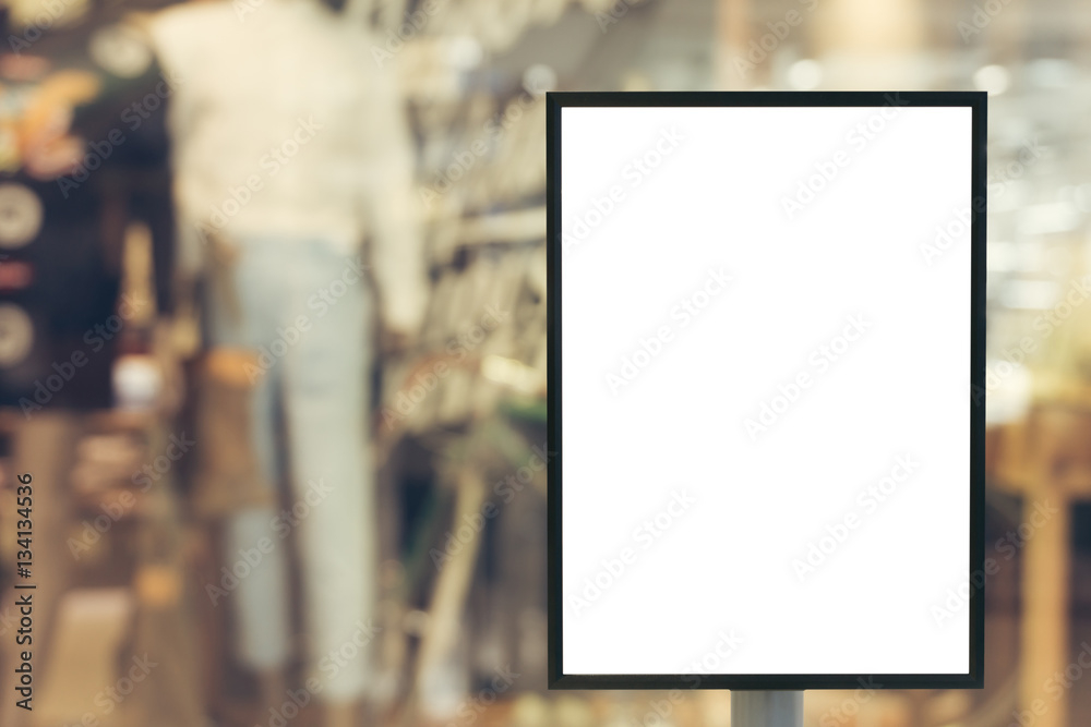 Blank mock up of vertical poster billboard sign with copy space for your text message or content in modern shopping mall. Blank mock up of vertical poster billboard sign with copy space for your text message or content in modern shopping mall.