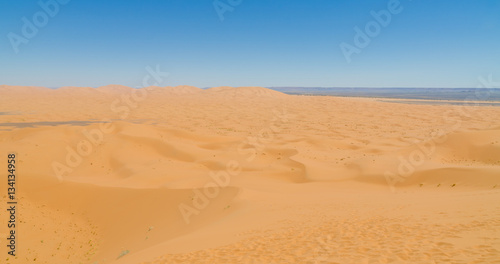 Famous and inconic sahara sand dunes of Erg Chebbi in the Moroccan desert near Merzouga, Morocco, North Africa