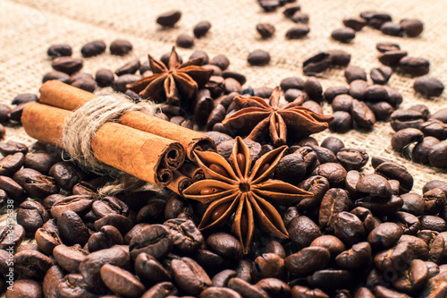Coffee beans with cinnamon and anise on the sackcloth © masanyanka