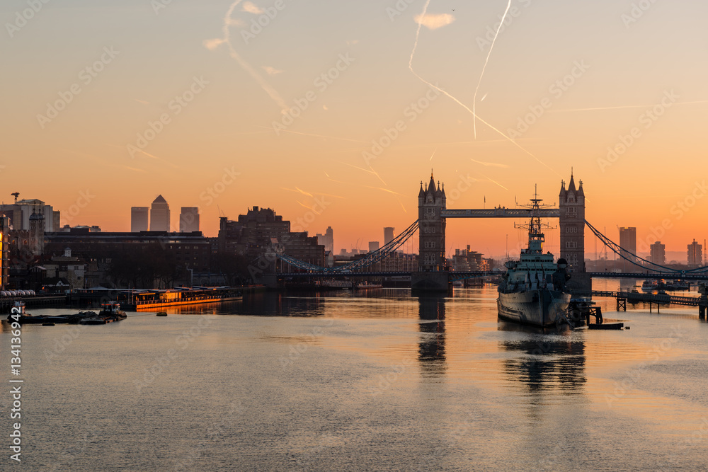 Sunrise over Tower Bridge from London Bridge with HMS Belfast