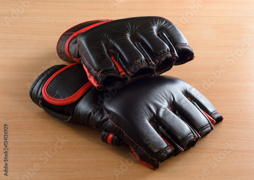 mma gloves on wooden background