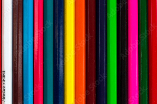 Vertical colourful stripes of multicoloured wooden pencils backg