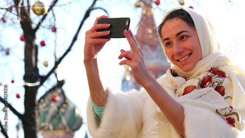 Selfie. Close up, Young beautiful woman on Red Square, Moscow, Russia photo