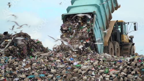 trucks on a landfill site photo